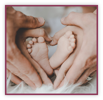 Hands holding baby's feet