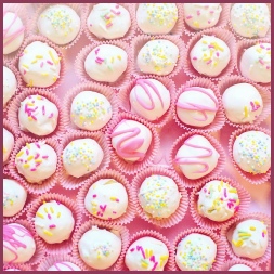Fancy white chocolates in pink wrappers